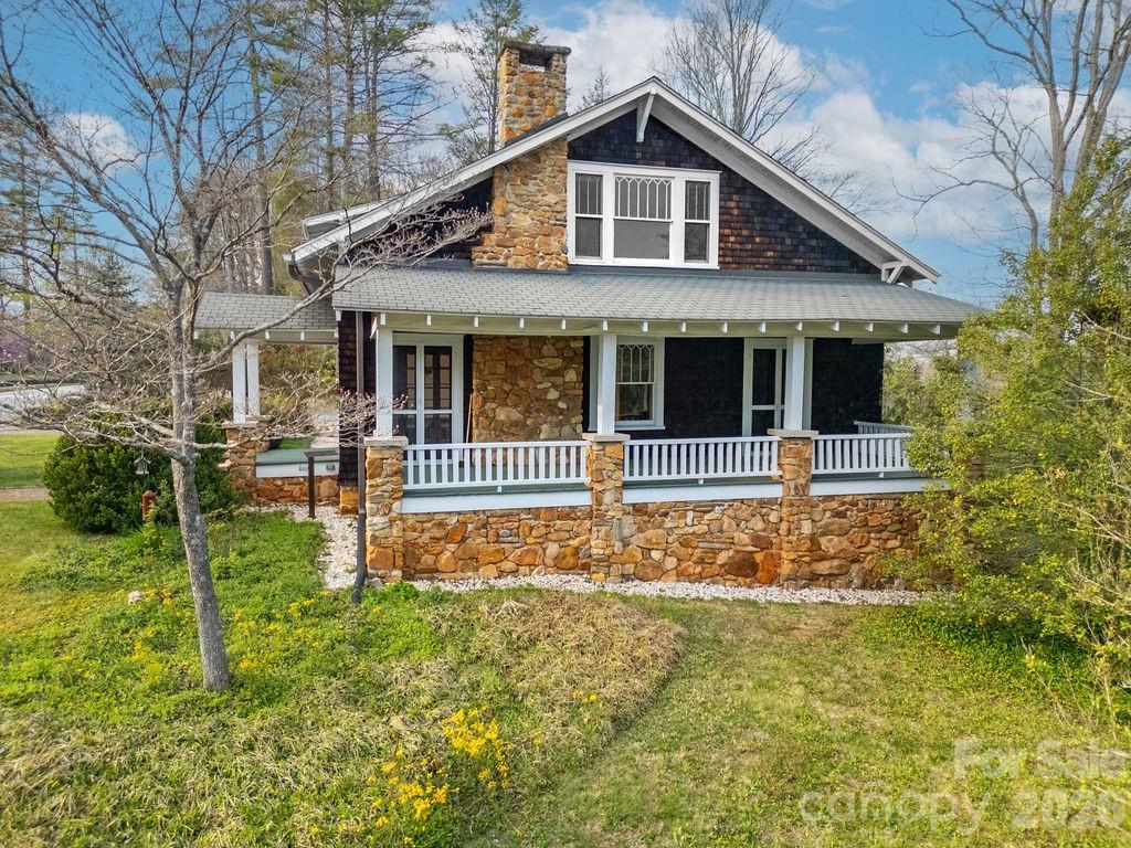 431 East Main Street Brevard, NC 28712 - Photo 5 of 45 a front view of a house with a yard
