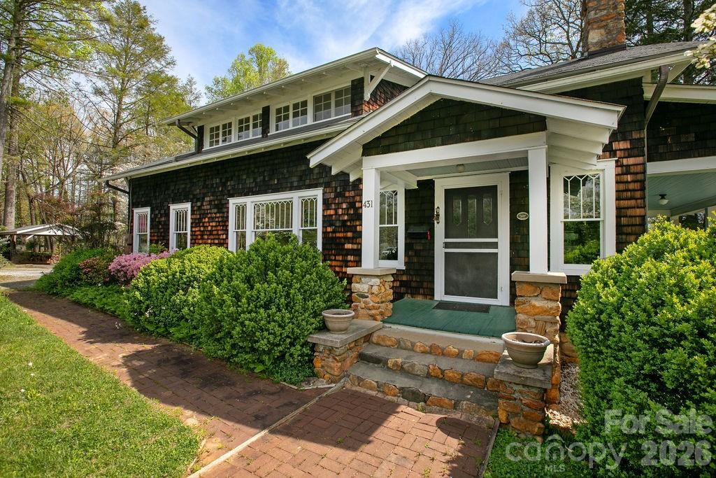 431 East Main Street Brevard, NC 28712 - Photo 6 of 45 a front view of a house with garden