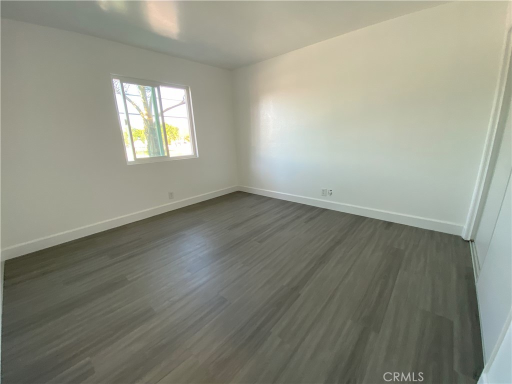 2826 Cogswell Road, Unit A #M El Monte, CA 91732 - Photo 15 of 55 an empty room with wooden floor and windows