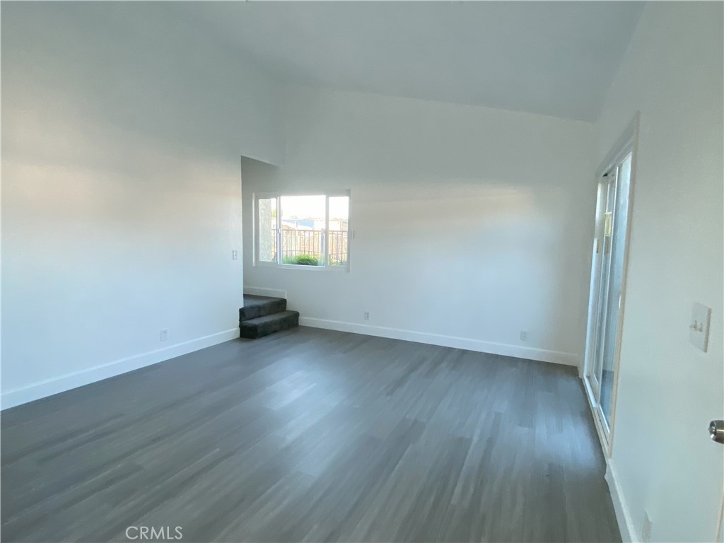 2826 Cogswell Road, Unit A #M El Monte, CA 91732 - Photo 17 of 55 an empty room with wooden floor and windows