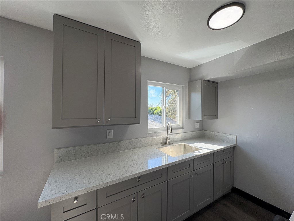 2826 Cogswell Road, Unit A #M El Monte, CA 91732 - Photo 24 of 55 a kitchen with a sink and cabinets