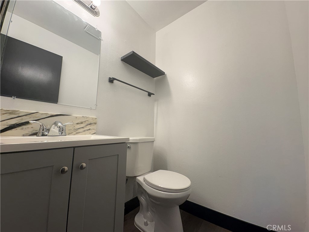 2826 Cogswell Road, Unit A #M El Monte, CA 91732 - Photo 28 of 55 a bathroom with a toilet a sink and mirror