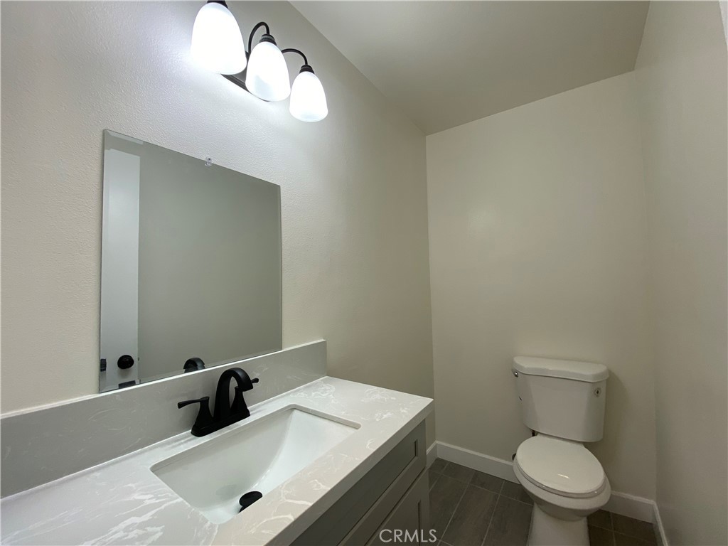 2826 Cogswell Road, Unit A #M El Monte, CA 91732 - Photo 42 of 55 a bathroom with a toilet sink and mirror