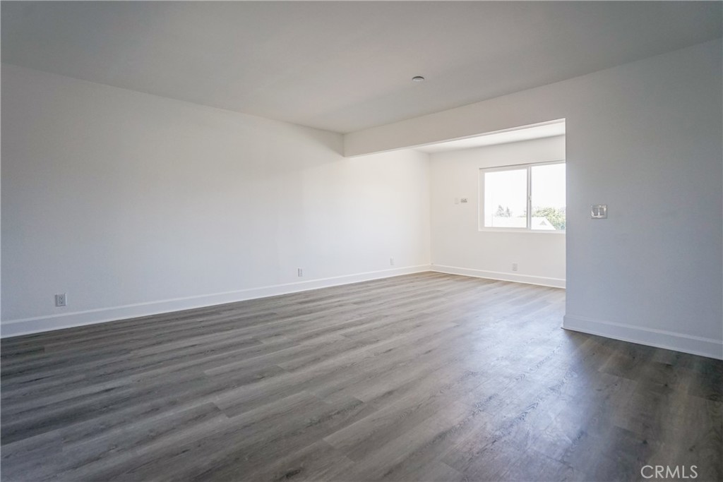2826 Cogswell Road, Unit A #M El Monte, CA 91732 - Photo 47 of 55 an empty room with wooden floor and windows