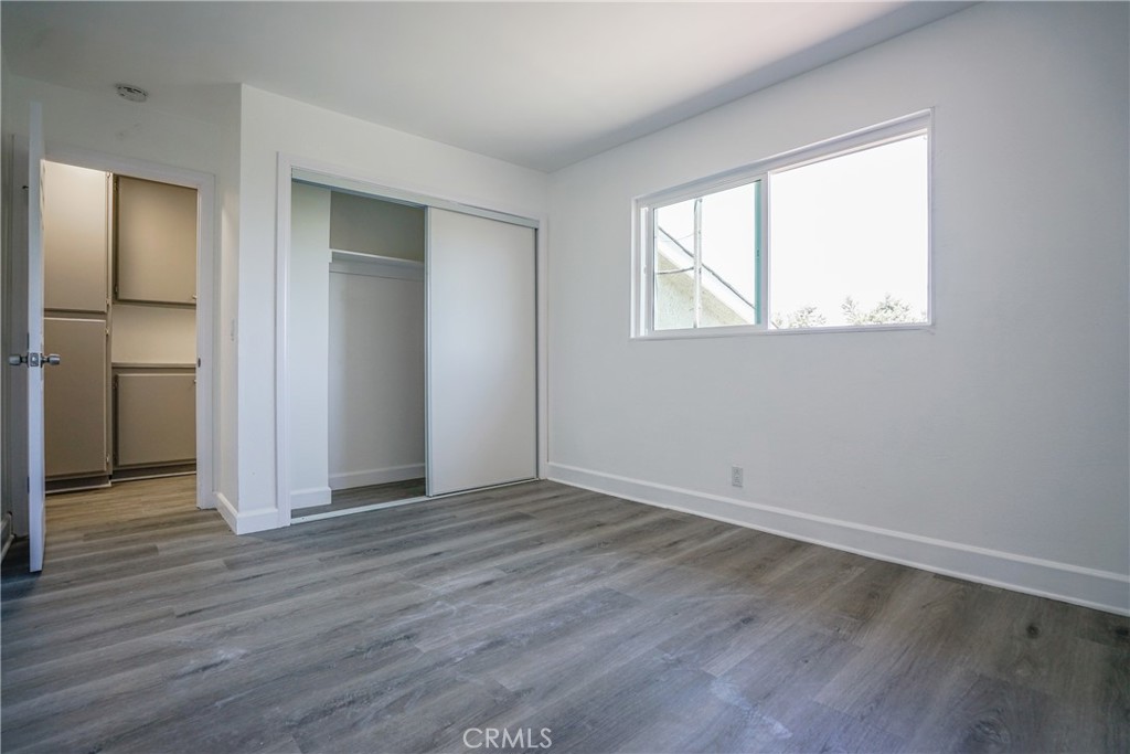 2826 Cogswell Road, Unit A #M El Monte, CA 91732 - Photo 50 of 55 a view of an empty room with wooden floor and a window
