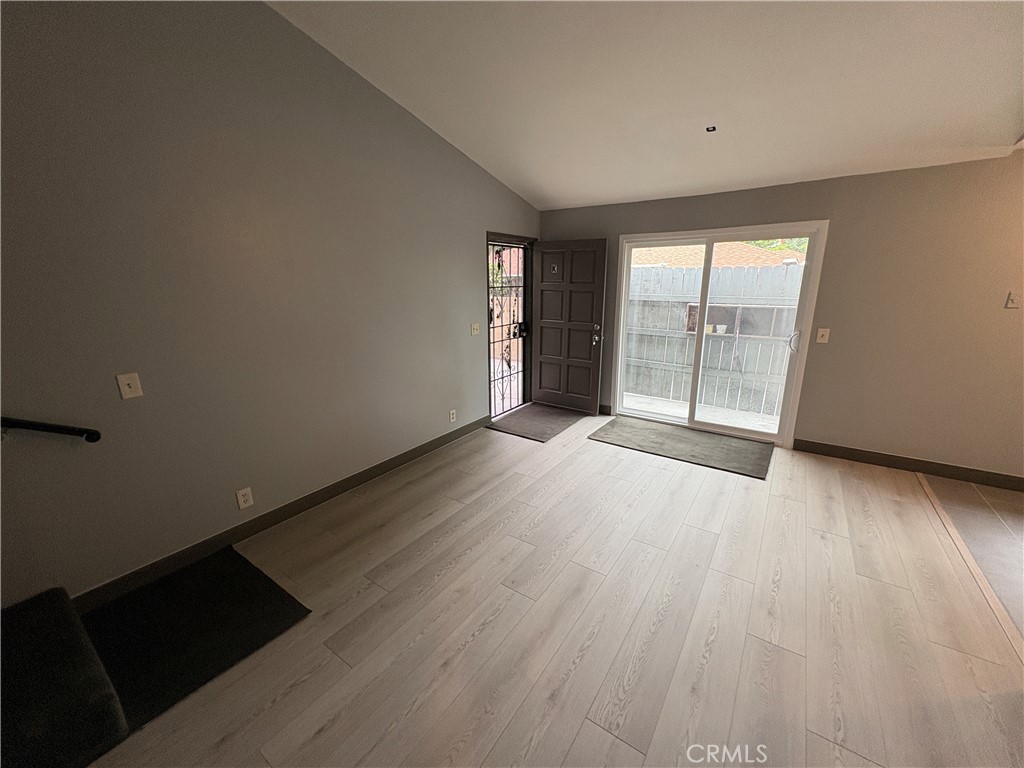 2826 Cogswell Road, Unit A #M El Monte, CA 91732 - Photo 9 of 55 wooden floor in an empty room with a window