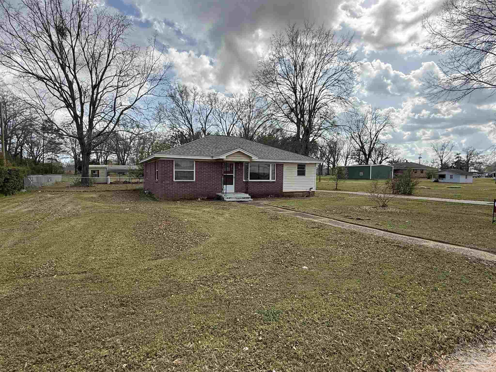 3971 Highway 4 Jay, FL 32565 - Photo 1 of 19 a view of a house with a yard and sitting area
