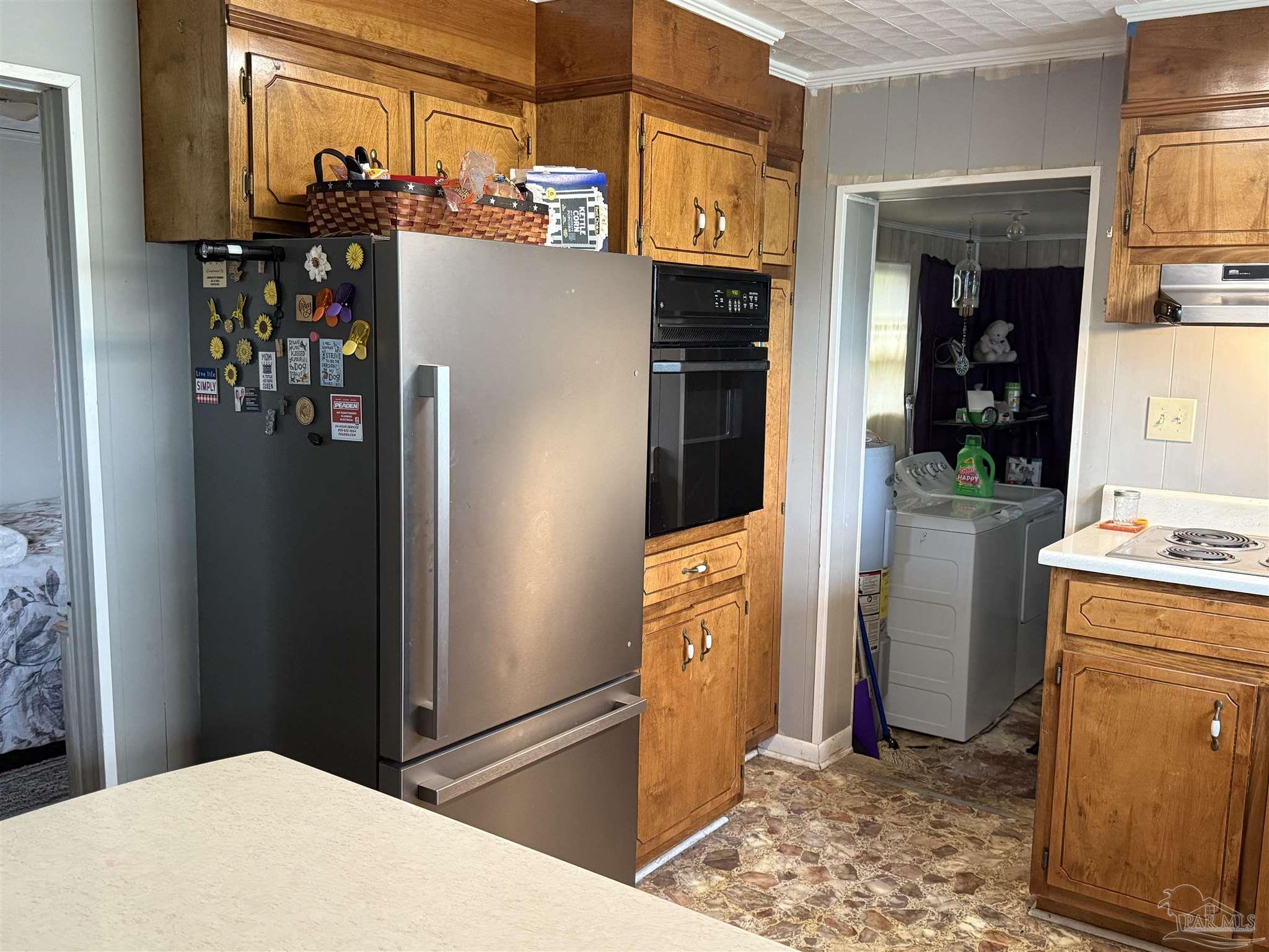 3971 Highway 4 Jay, FL 32565 - Photo 11 of 19 a kitchen with a refrigerator and a sink