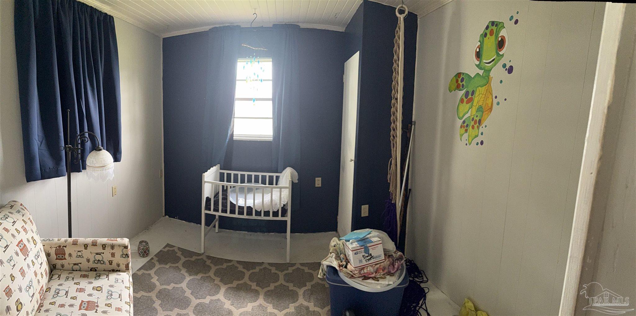 3971 Highway 4 Jay, FL 32565 - Photo 18 of 19 a bedroom with a bed and a window