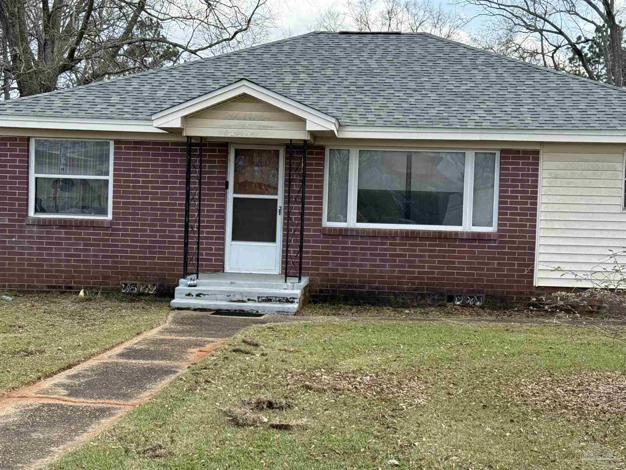 3971 Highway 4 Jay, FL 32565 - Photo 2 of 19 a front view of a house with a garden