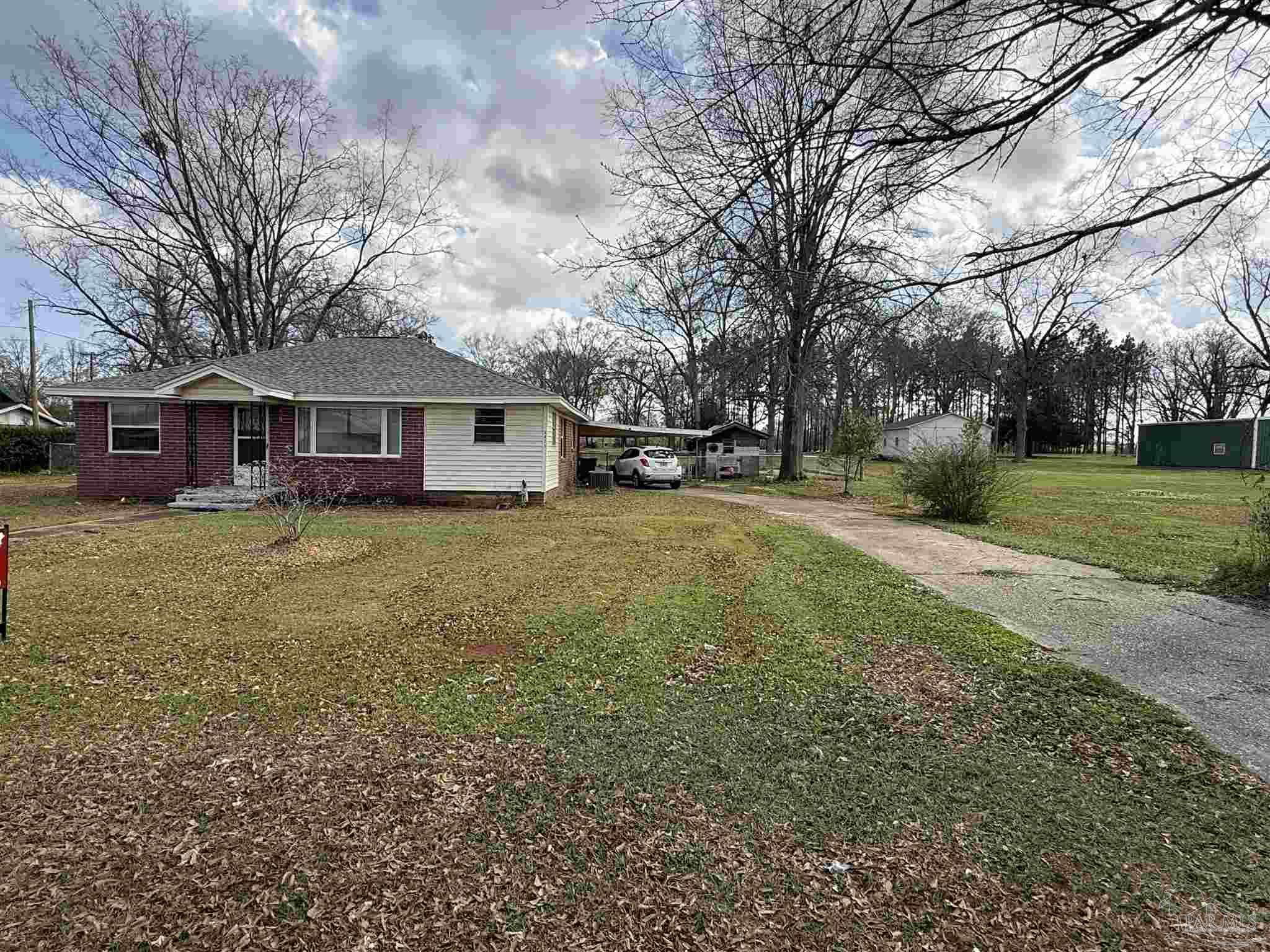 3971 Highway 4 Jay, FL 32565 - Photo 4 of 19 a view of a house with a yard and sitting area