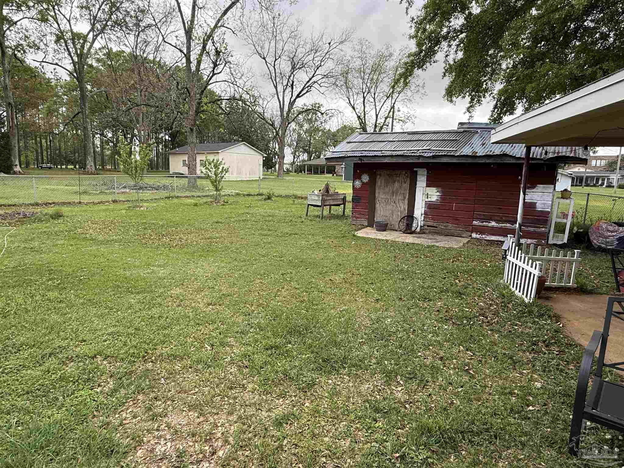 3971 Highway 4 Jay, FL 32565 - Photo 6 of 19 a view of a wooden house with a yard