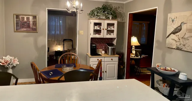 a kitchen with a sink appliances and cabinets