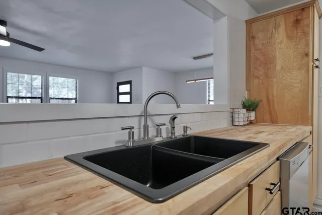a kitchen with a sink and a window