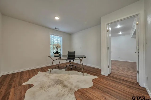 a workspace with furniture and wooden floor