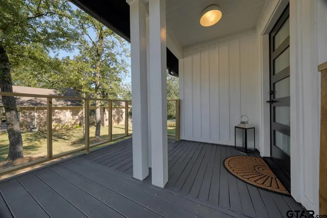 a view of room with window and wooden floor