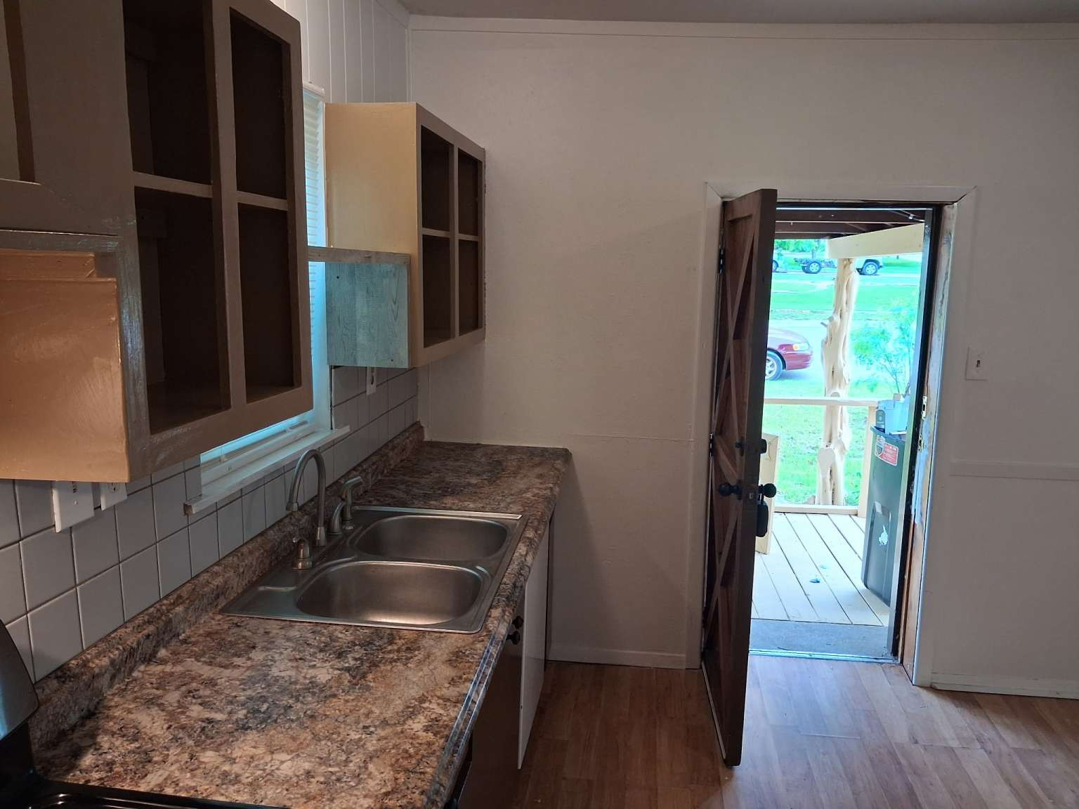 308 North Ridge Street Lampasas, TX 76550 - Photo 2 of 16 a kitchen with a sink and a large window