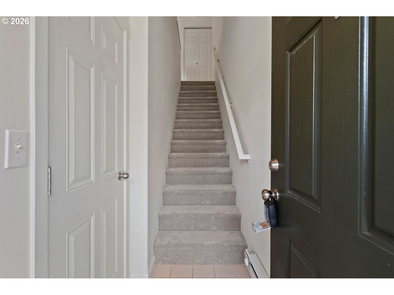 15450 Southwest Sparrow Loop, Unit 102 Beaverton, OR 97007 - Photo 23 of 27 a view of entryway and hall with wooden floor