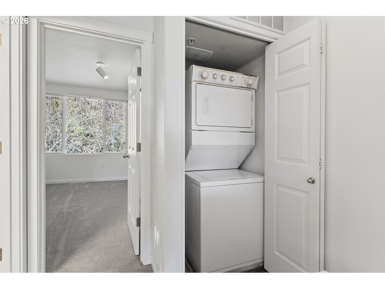 15450 Southwest Sparrow Loop, Unit 102 Beaverton, OR 97007 - Photo 24 of 27 a utility room with closet dryer and washer
