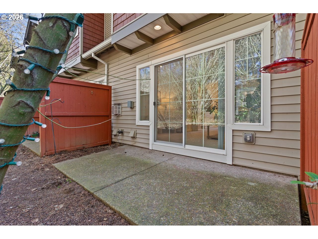 15450 Southwest Sparrow Loop, Unit 102 Beaverton, OR 97007 - Photo 25 of 27 a view of backyard with garage