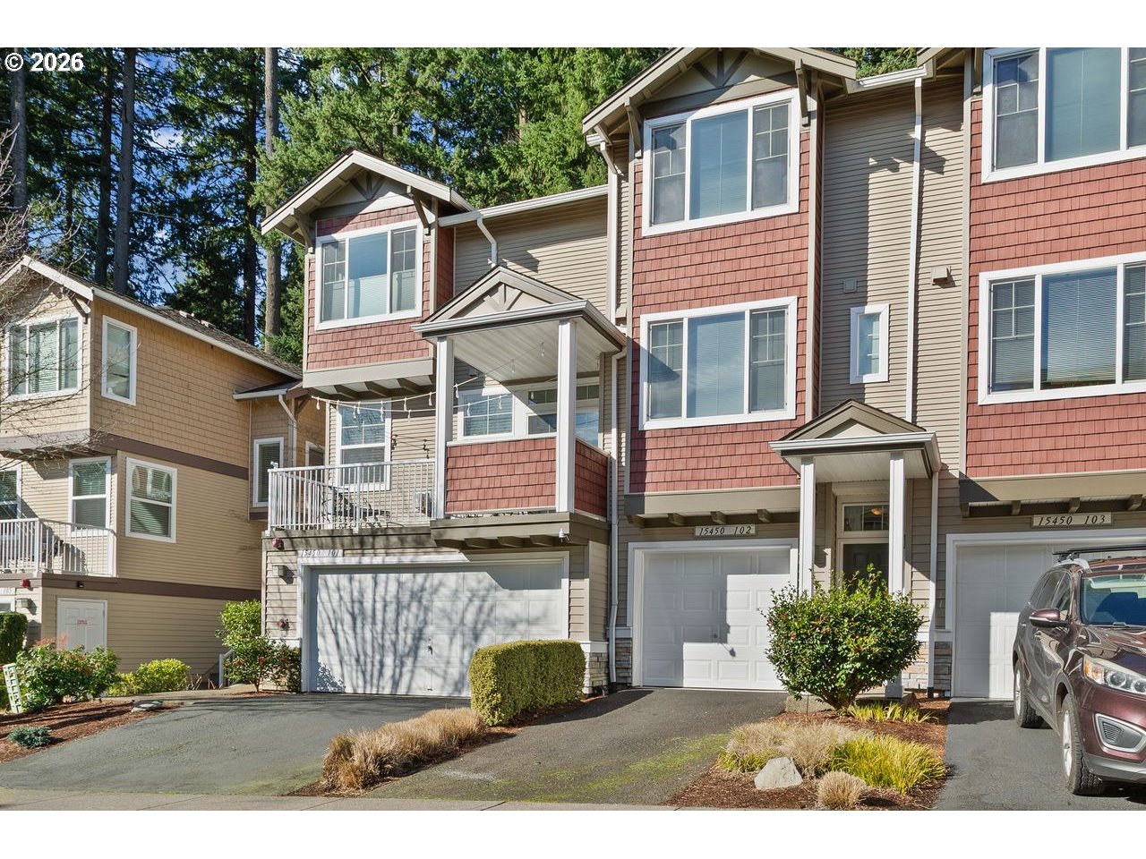 15450 Southwest Sparrow Loop, Unit 102 Beaverton, OR 97007 - Photo 27 of 27 a front view of a house with a yard