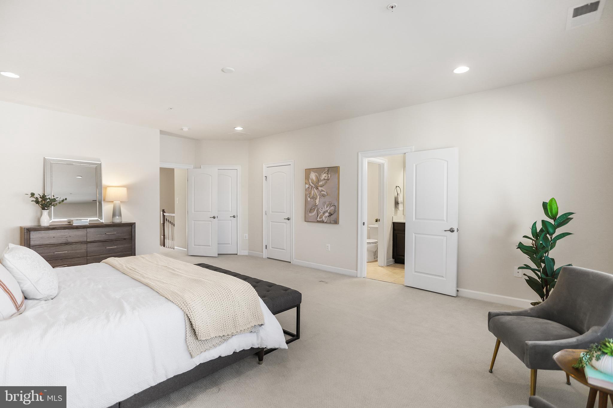 603 Stonecliffe Road Malvern, PA 19355 - Photo 18 of 30 Spacious, serene bedroom with modern elegance.