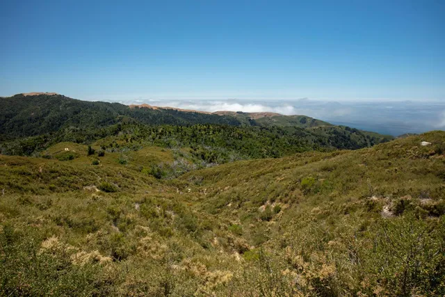 a view of mountains and valleys