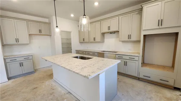 a view of a kitchen counter top space and appliances