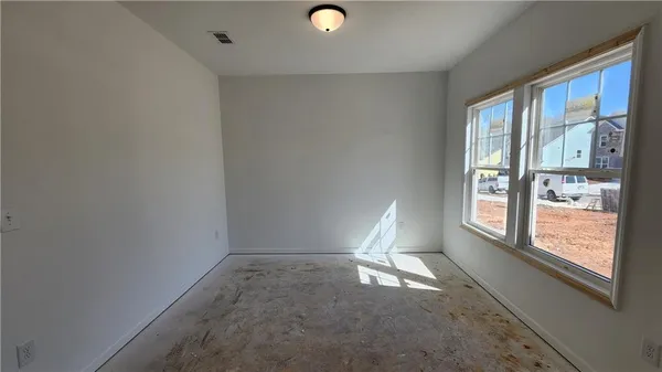 a view of livingroom with furniture and window