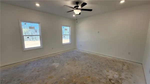 a view of an empty room with a window