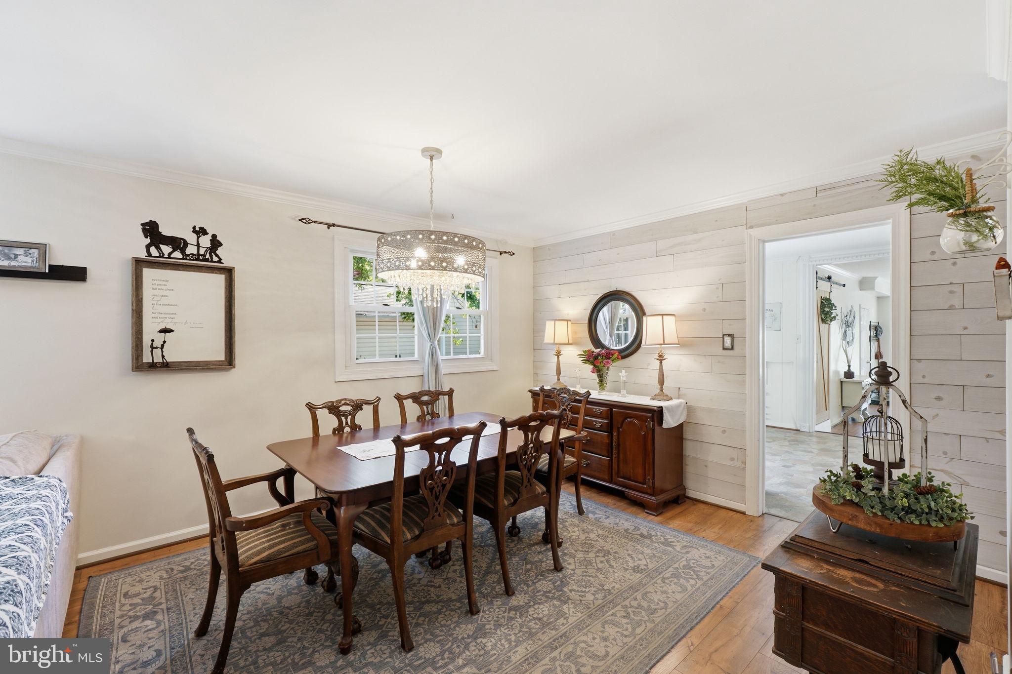19608 Gott Street Poolesville, MD 20837 - Photo 23 of 43 a view of a dining room with furniture and chandelier