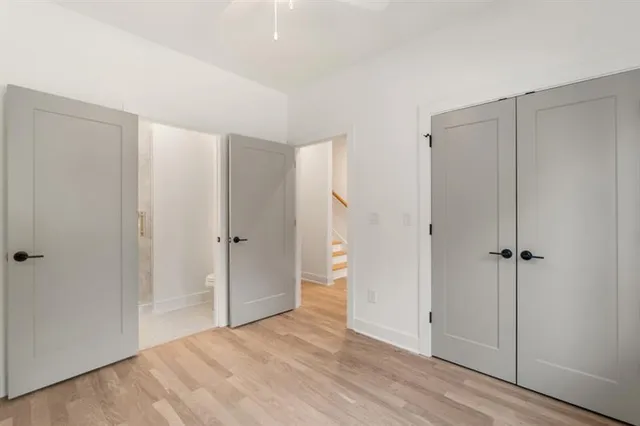 a view of an entryway with wooden floor