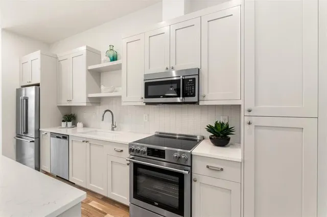 a very nice looking dining room with a table and chairs