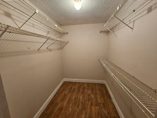 a view of a room with racks on the wall