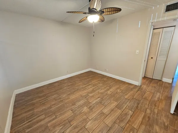 a view of room with wooden floor