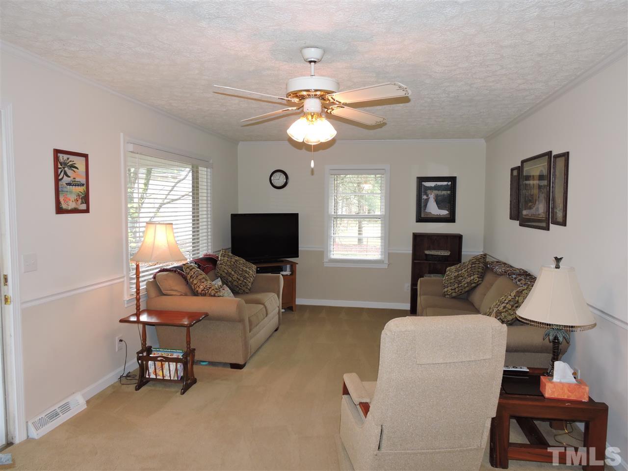 1104 Ridge Road Roxboro, NC 27573 - Photo 2 of 15 a living room with furniture and a flat screen tv