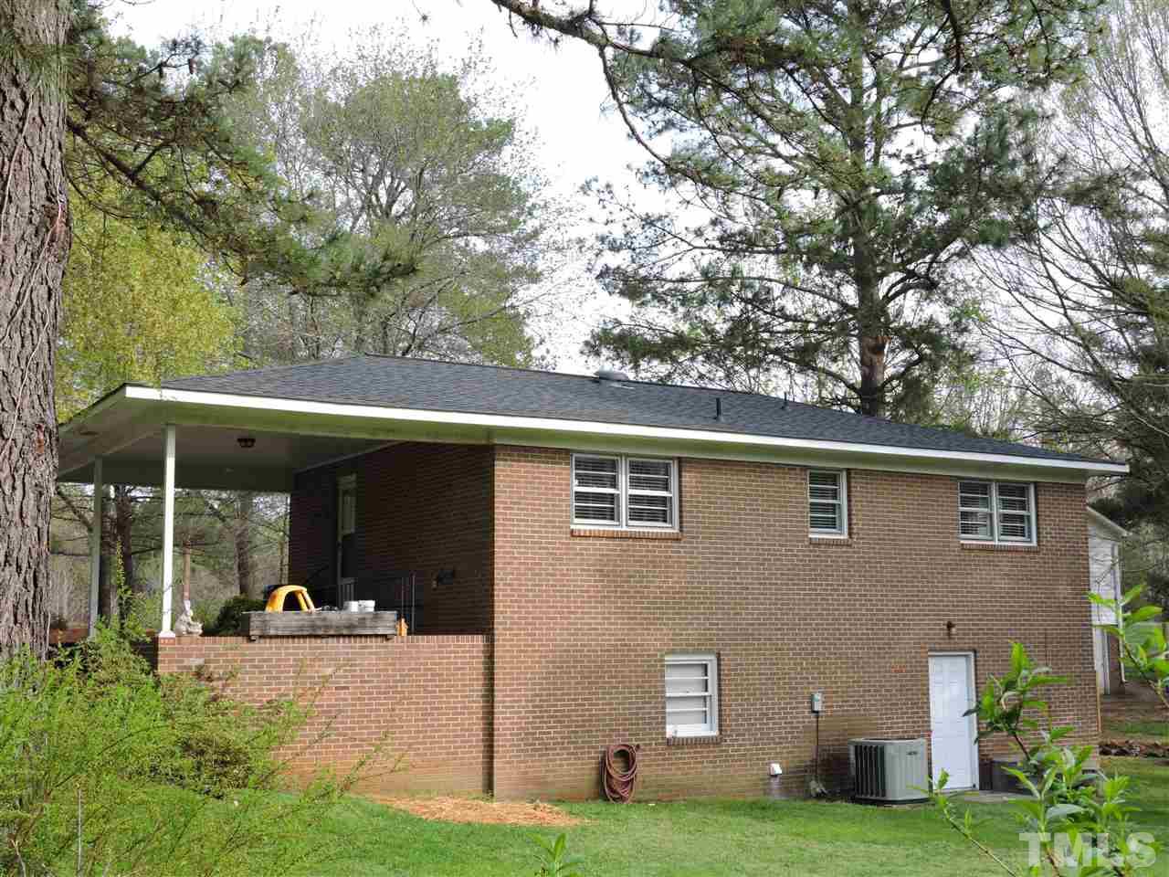 1104 Ridge Road Roxboro, NC 27573 - Photo 13 of 15 a view of a house with backyard and porch