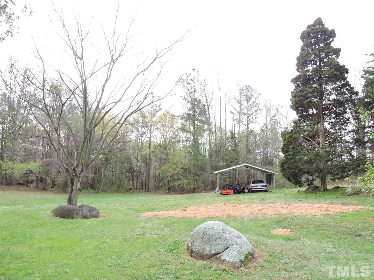 1104 Ridge Road Roxboro, NC 27573 - Photo 15 of 15 a house with trees in the background