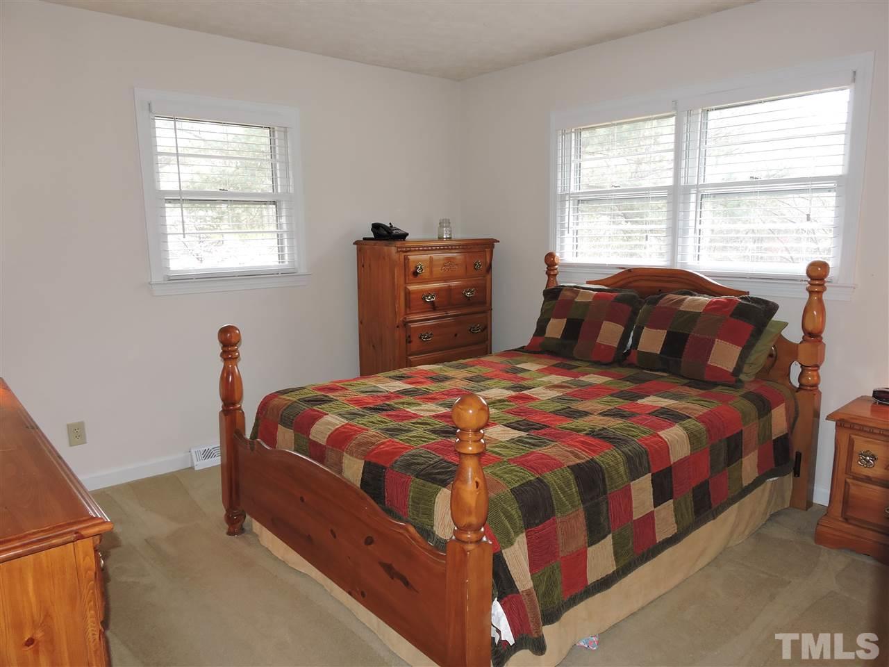 1104 Ridge Road Roxboro, NC 27573 - Photo 8 of 15 a bedroom with a bed and window