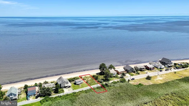 a view of a lake with a house in the background