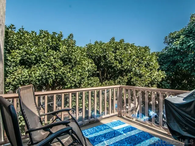 a view of a wooden bench on the deck