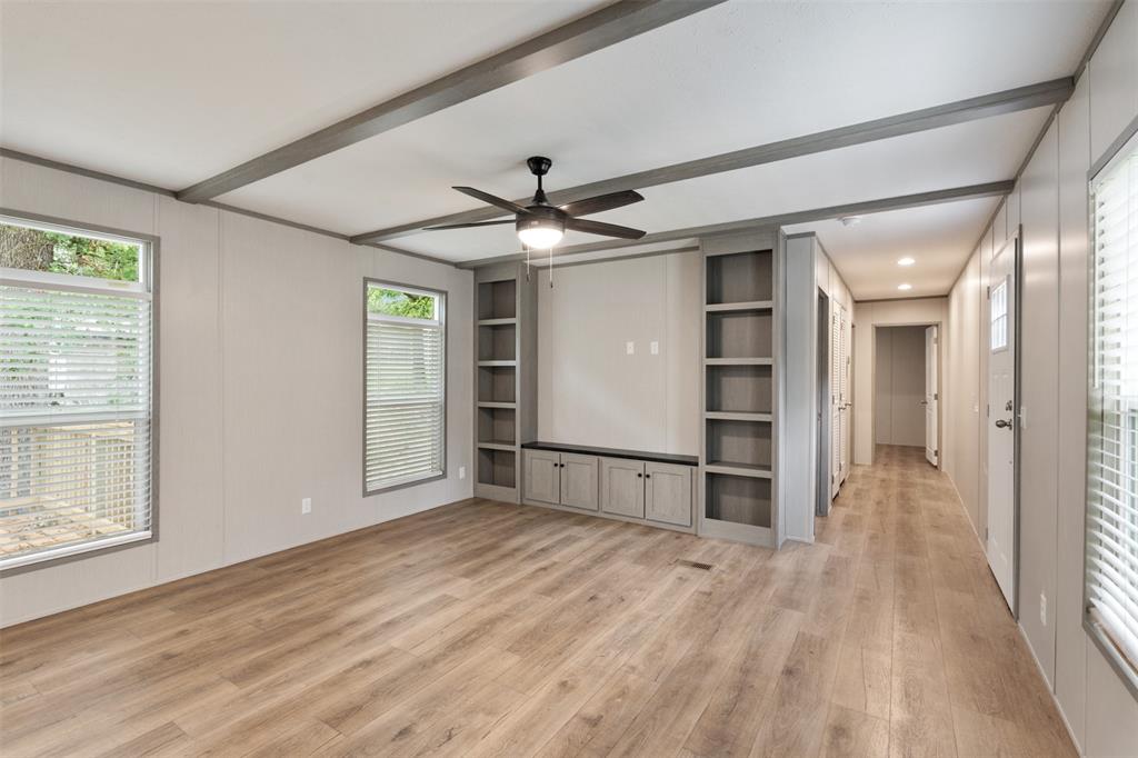125 Neches Mabank, TX 75156 - Photo 5 of 23 wooden floor in an empty room with a window