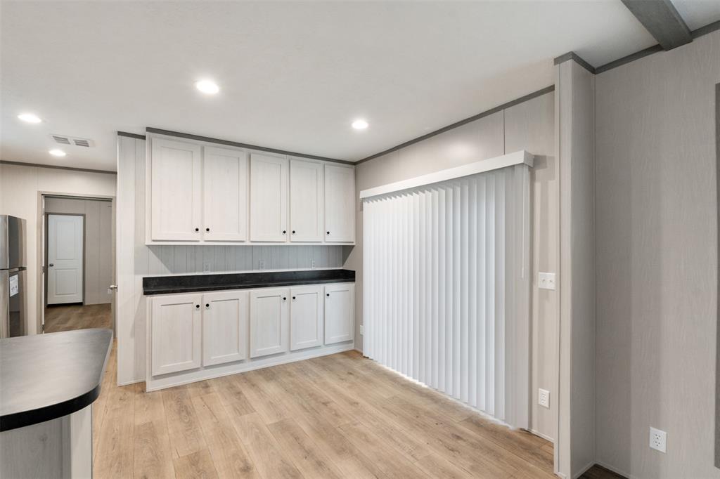 125 Neches Mabank, TX 75156 - Photo 8 of 23 a view of a kitchen with granite countertop cabinets