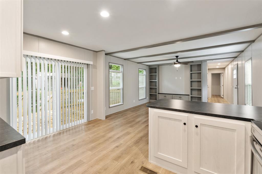 125 Neches Mabank, TX 75156 - Photo 10 of 23 a kitchen with granite countertop a sink and cabinets