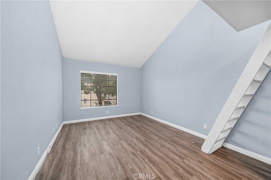4900 North Grand Avenue, Unit 104 Covina, CA 91724 - Photo 18 of 27 a view of room with window and hardwood floor