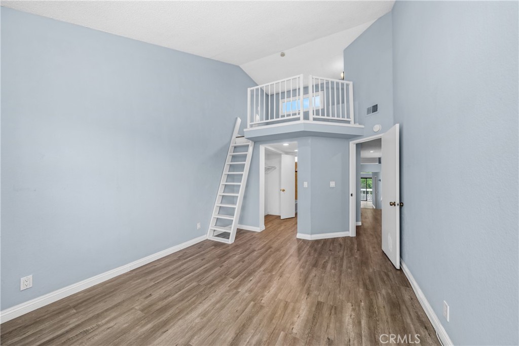 4900 North Grand Avenue, Unit 104 Covina, CA 91724 - Photo 19 of 27 wooden floor in an empty room
