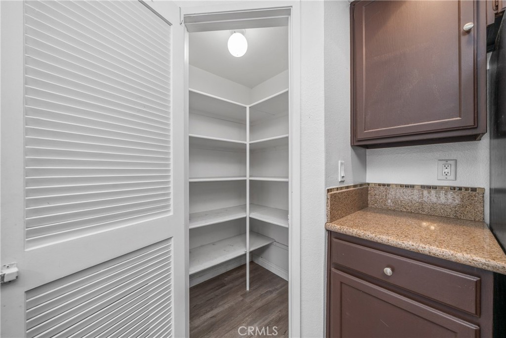 4900 North Grand Avenue, Unit 104 Covina, CA 91724 - Photo 23 of 27 a kitchen with a sink and a microwave