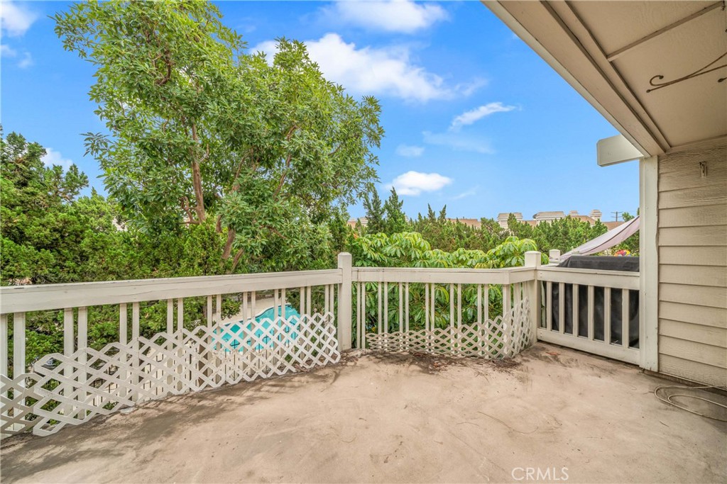 4900 North Grand Avenue, Unit 104 Covina, CA 91724 - Photo 3 of 27 a front view of a house with a garden