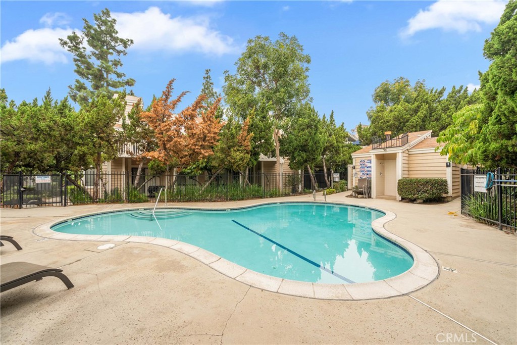 4900 North Grand Avenue, Unit 104 Covina, CA 91724 - Photo 7 of 27 a view of a house with swimming pool