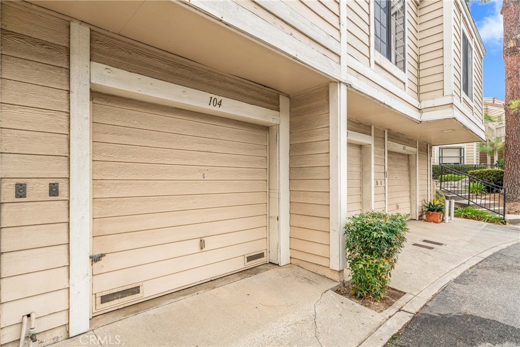 4900 North Grand Avenue, Unit 104 Covina, CA 91724 - Photo 9 of 27 a view of a house with a outdoor space